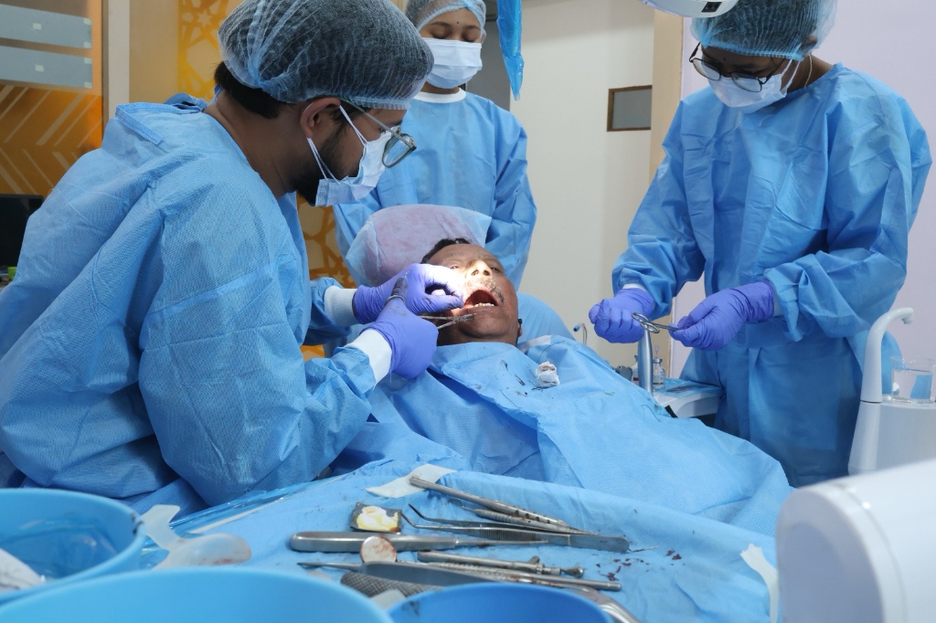 Dr. Madhurjya and team performing implant surgery